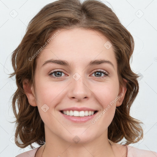 Joyful white young-adult female with medium  brown hair and green eyes