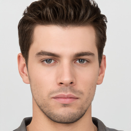 Neutral white young-adult male with short  brown hair and brown eyes