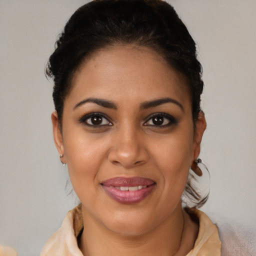 Joyful latino young-adult female with short  brown hair and brown eyes