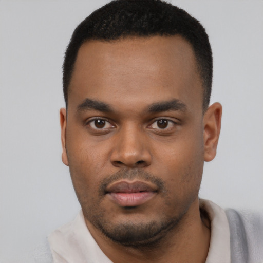 Neutral black young-adult male with short  black hair and brown eyes