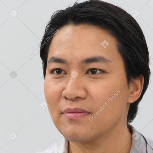 Joyful asian young-adult male with short  black hair and brown eyes