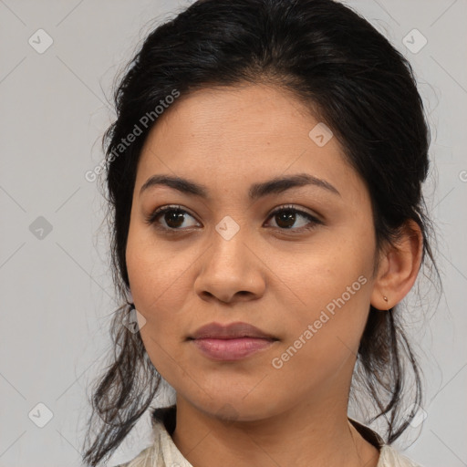 Joyful latino young-adult female with medium  brown hair and brown eyes