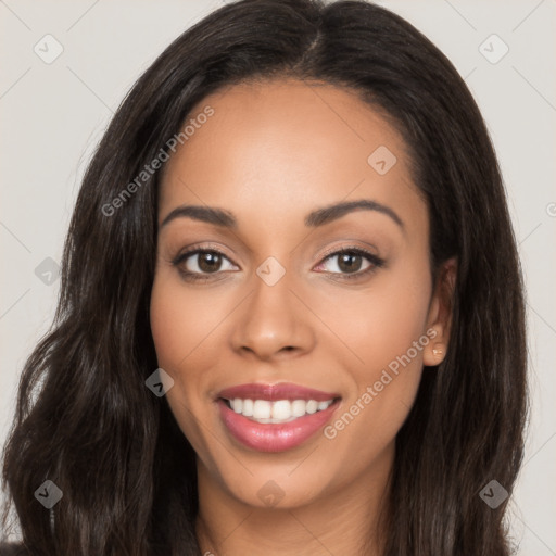 Joyful latino young-adult female with long  brown hair and brown eyes