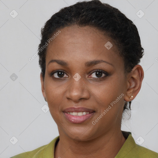 Joyful black young-adult female with short  brown hair and brown eyes