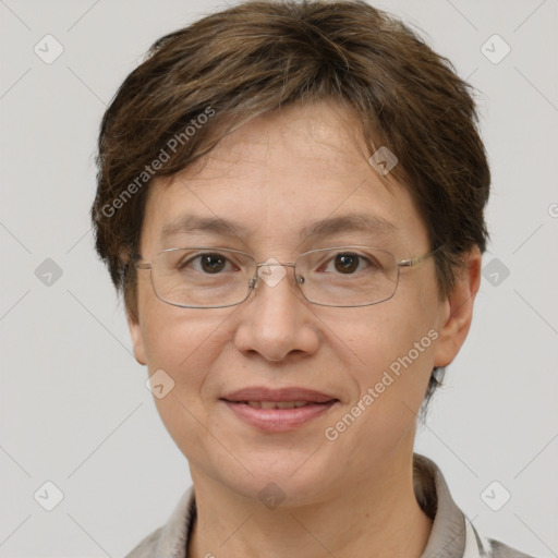 Joyful white adult female with short  brown hair and grey eyes