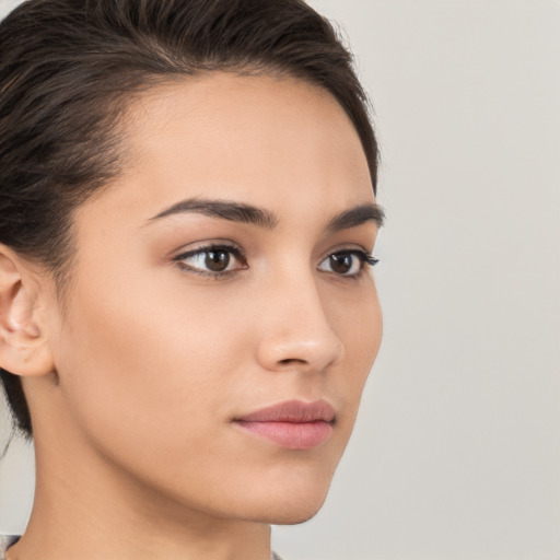 Neutral white young-adult female with long  brown hair and brown eyes