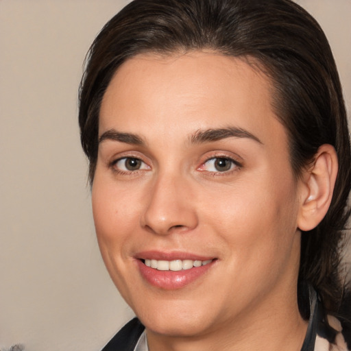 Joyful white young-adult female with medium  brown hair and brown eyes