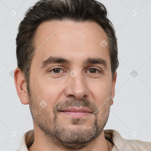 Joyful white adult male with short  brown hair and brown eyes