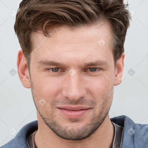 Joyful white adult male with short  brown hair and grey eyes