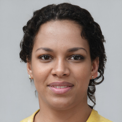 Joyful latino young-adult female with short  brown hair and brown eyes