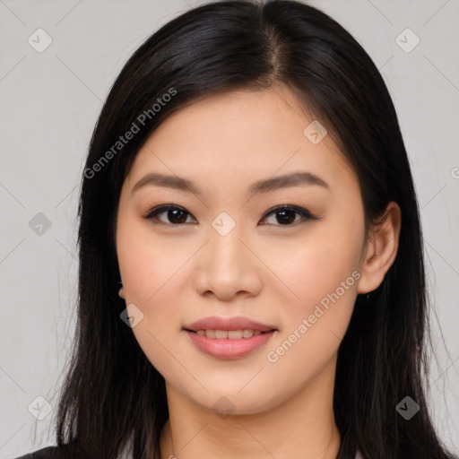 Joyful asian young-adult female with long  brown hair and brown eyes