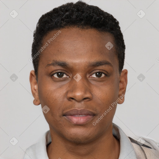 Joyful black young-adult male with short  brown hair and brown eyes