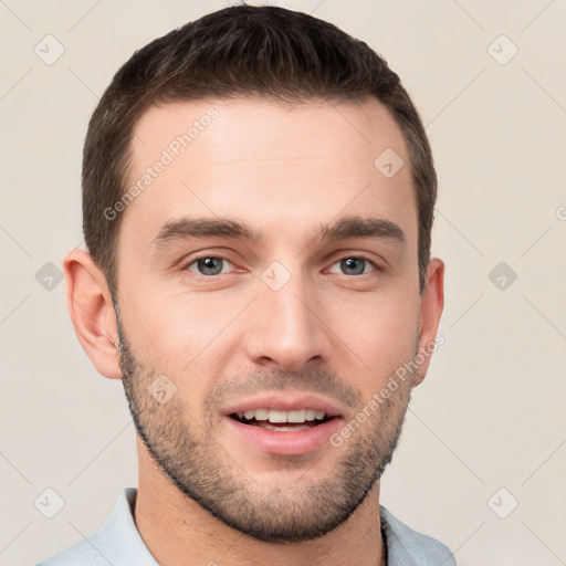 Joyful white young-adult male with short  brown hair and brown eyes