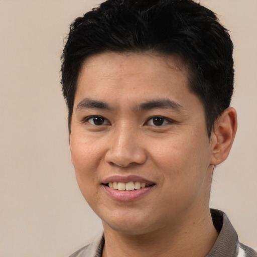 Joyful white young-adult male with short  black hair and brown eyes