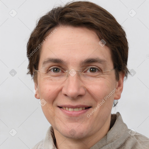 Joyful white adult female with short  brown hair and grey eyes