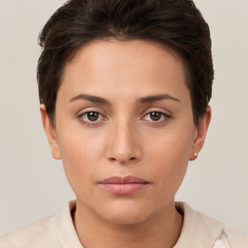 Neutral white young-adult female with short  brown hair and brown eyes