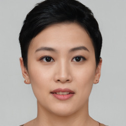 Joyful asian young-adult female with short  black hair and brown eyes