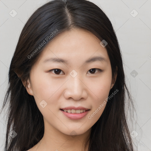 Joyful asian young-adult female with long  brown hair and brown eyes