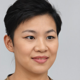 Joyful asian young-adult female with short  brown hair and brown eyes