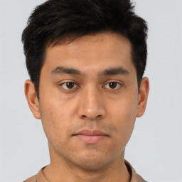 Neutral asian young-adult male with short  brown hair and brown eyes