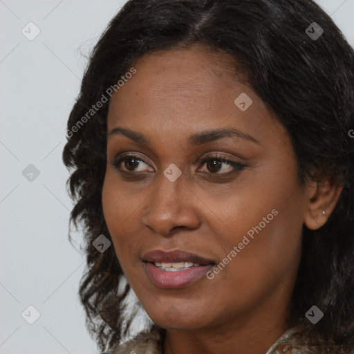 Joyful black adult female with medium  brown hair and brown eyes