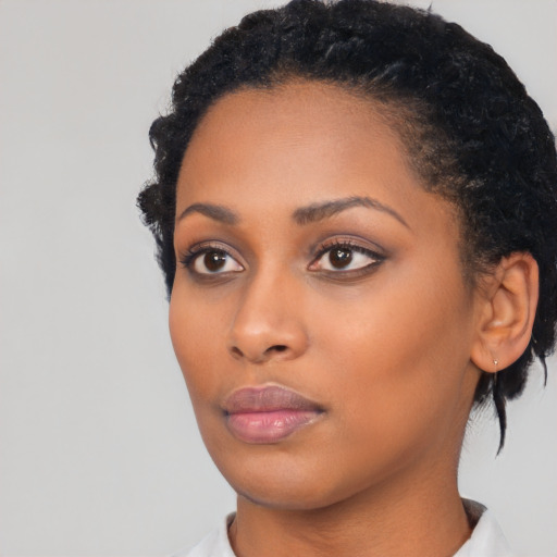 Neutral black young-adult female with short  black hair and brown eyes