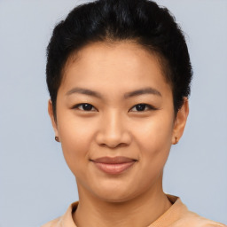 Joyful asian young-adult female with short  brown hair and brown eyes