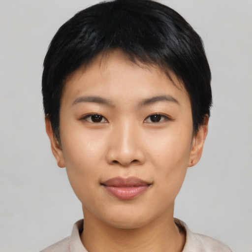 Joyful asian young-adult female with short  black hair and brown eyes
