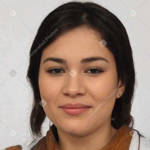 Joyful latino young-adult female with medium  brown hair and brown eyes