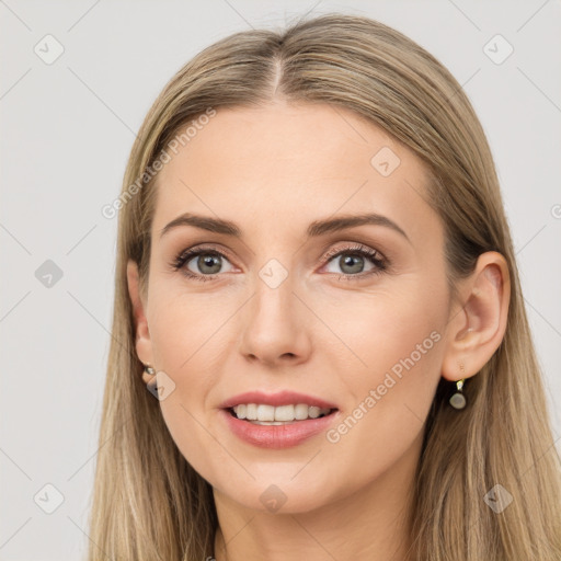 Joyful white young-adult female with long  brown hair and grey eyes