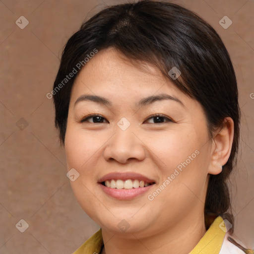 Joyful asian young-adult female with medium  brown hair and brown eyes