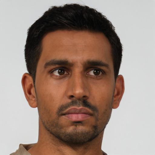 Neutral latino young-adult male with short  brown hair and brown eyes