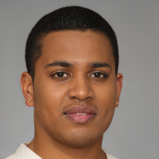 Joyful latino young-adult male with short  brown hair and brown eyes