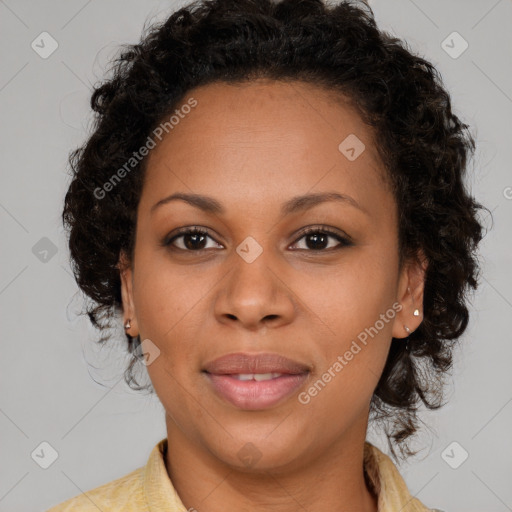 Joyful black young-adult female with medium  brown hair and brown eyes