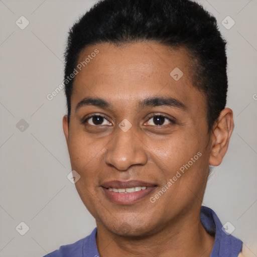 Joyful black young-adult male with short  brown hair and brown eyes