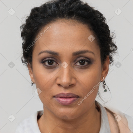 Joyful latino adult female with short  brown hair and brown eyes