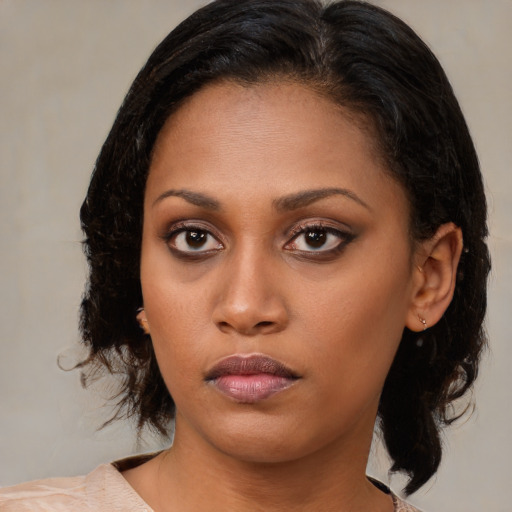 Neutral black young-adult female with medium  brown hair and brown eyes