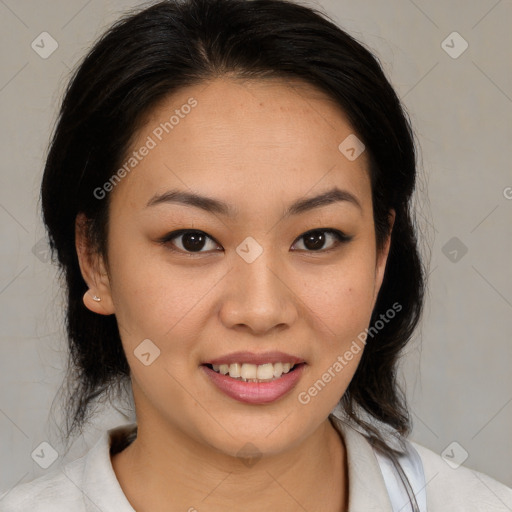 Joyful latino young-adult female with medium  brown hair and brown eyes