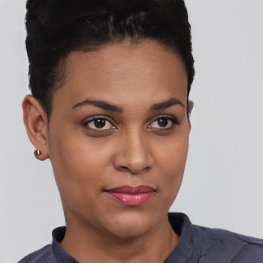 Joyful latino young-adult female with short  brown hair and brown eyes