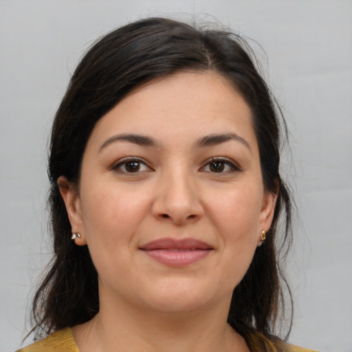 Joyful white young-adult female with medium  brown hair and brown eyes