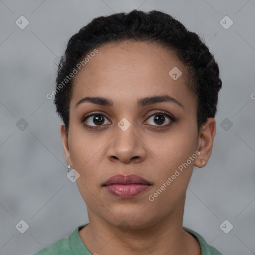 Joyful black young-adult female with short  brown hair and brown eyes