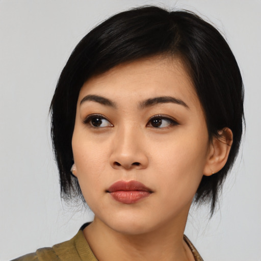 Neutral asian young-adult female with medium  black hair and brown eyes