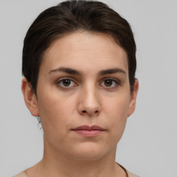 Neutral white young-adult female with short  brown hair and brown eyes