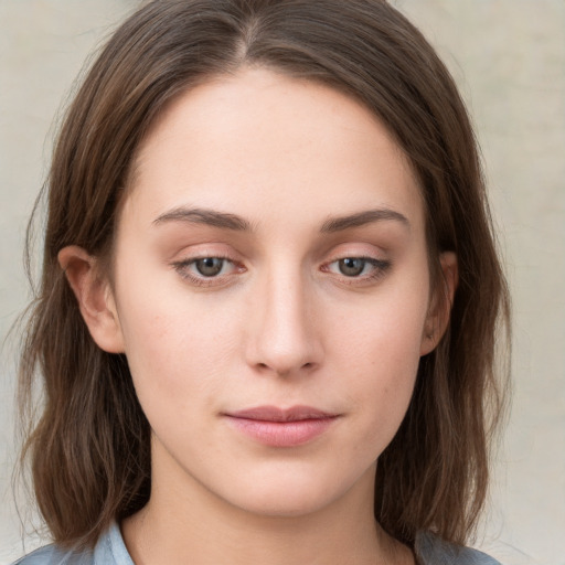 Neutral white young-adult female with medium  brown hair and grey eyes