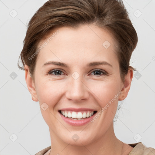 Joyful white young-adult female with short  brown hair and grey eyes