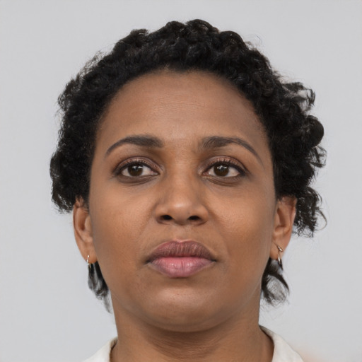 Neutral black young-adult female with short  brown hair and brown eyes