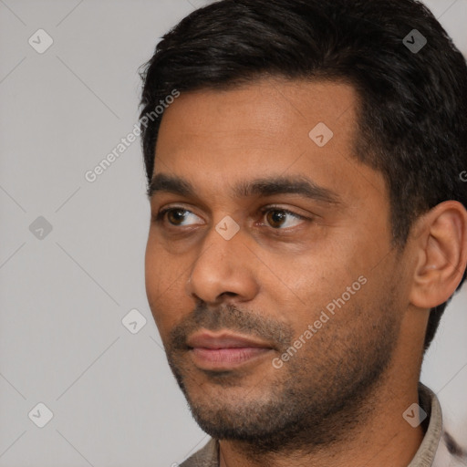 Neutral white young-adult male with short  black hair and brown eyes