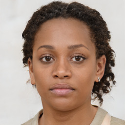 Neutral black young-adult female with medium  brown hair and brown eyes