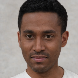 Neutral black young-adult male with short  black hair and brown eyes