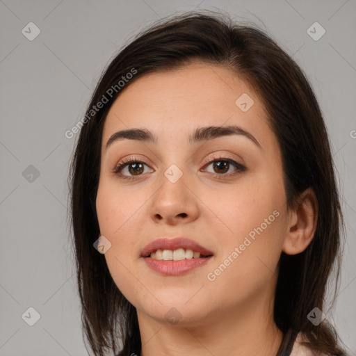 Joyful white young-adult female with medium  brown hair and brown eyes